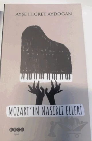 Mozart'ın Nasırlı Elleri – Ayşe Hicret Aydoğan – Hece Yayınları kitap kapağı